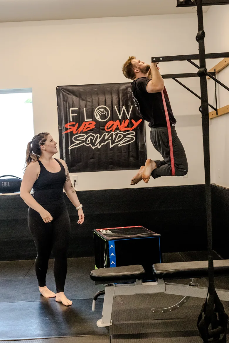 a member jumping onto a plyo box