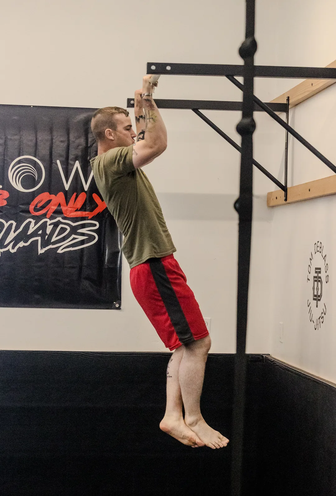 a member performing pull-ups on the rig