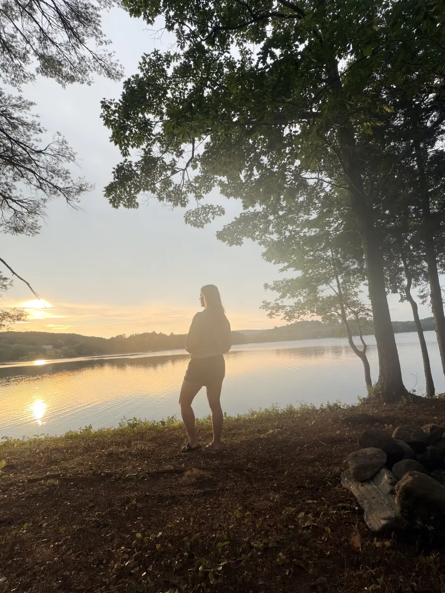 Sandy Martz at a lake at golden hour