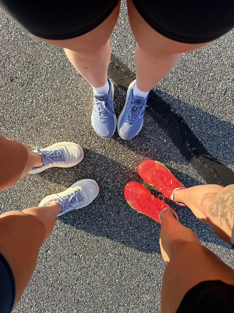 Four pairs of race shoes arranged in a circle before a race